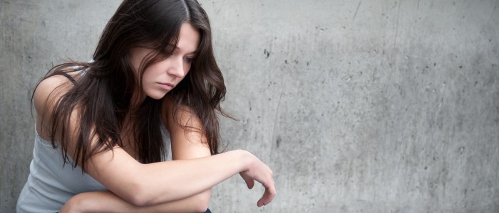 Teenage girl looking thoughtful about troubles
